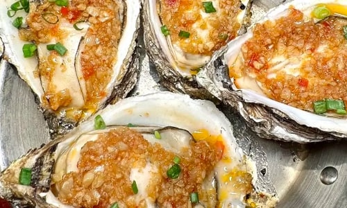 fresh oysters grilled with garlic fresh oysters grilled with garlic